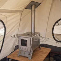 Poêle à bois de table haute performance avec motif ajouré artistique et pieds pliables pour le chauffage des tentes de camping