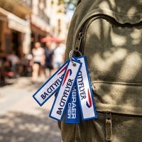 Porte-clés en sangle de caoutchouc avec impression numérique de logo personnalisé, anneau métallique argenté, broderie de chien, double face, étiquette d'identification pour clés d'aviation
