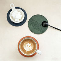 Lot de sous-verres ronds modernes en cuir PU, personnalisables avec logo, faits à la main, style européen classique, support pour tasses et boissons, vente en gros usine