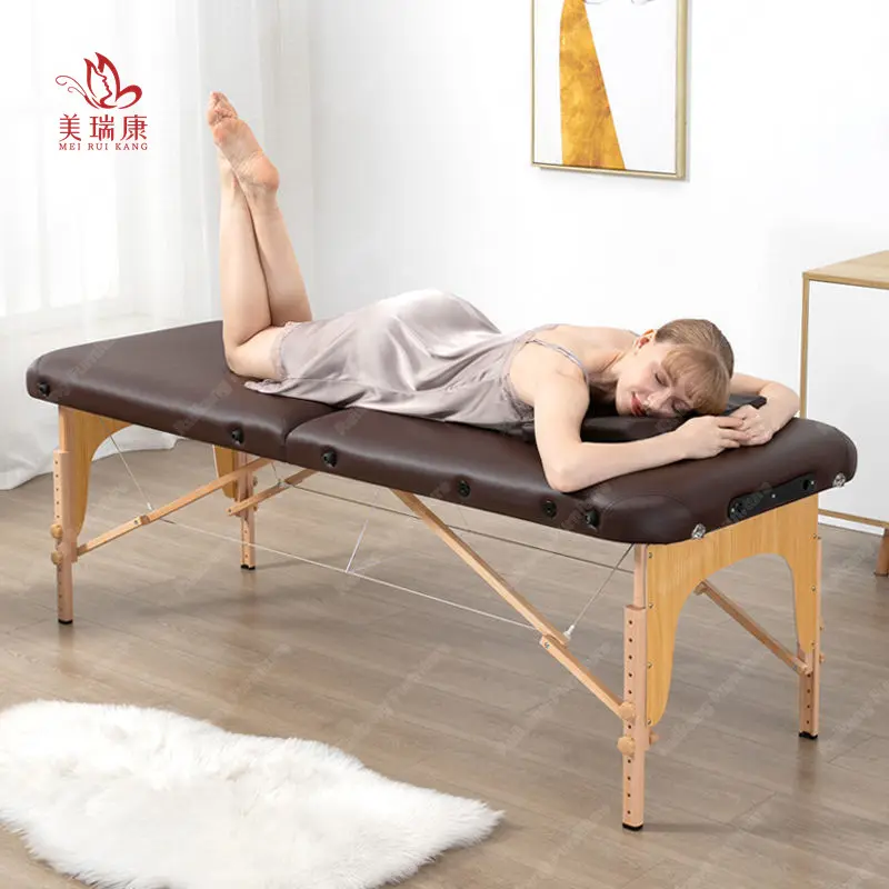 Cama de masaje de tratamiento de tatuaje plegable portátil con patas de madera directamente de fábrica