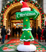 Panneau directionnel de Noël gonflable avec logo, flèche rouge et verte indiquant l'atelier du Père Noël pour la signalisation des centres commerciaux et des événements