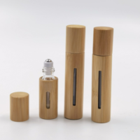 Flacons roll-on en verre de 10 ml avec bouchon en bambou et billes en acier inoxydable, étanches, portables pour le stockage d'huiles essentielles et de parfums.