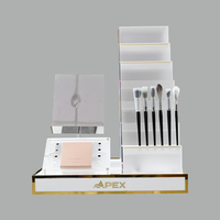 Présentoir de magasin de cosmétiques de luxe APEX Eyeliner acrylique support de brosse de maquillage présentoir de maquillage de Table pour le magasin