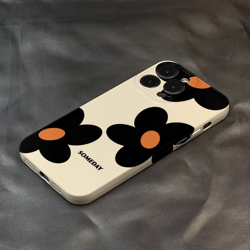 Three Orange-Cored Black Flowers