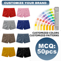 Shorts pour hommes, mode, entrejambe court de 2,5 pouces, design de marque, fermeture à boutons, accents sur l'ourlet, shorts pour hommes en tissu extensible soyeux