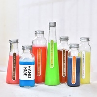 Bouteille en verre normale pour boissons, jus de fruits, confiture avec bouchon en étain vissé et couvercle en bois