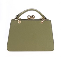 Sac à main bandoulière de luxe en PU couleur unie motif bonbon, avec deux sangles, fermeture éclair et fermoir, doublure en polyester, style vegan
