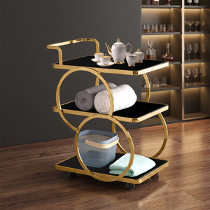 Chariot de bar moderne à trois niveaux avec roulettes, plateau en verre noir, structure en métal doré, étagère de rangement pour le service de boissons dans le salon - Product Image 6
