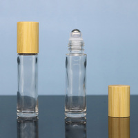 Flacon roll-on d'huile essentielle en verre transparent de 10 ml, marque Lvhuan, Zhejiang, avec bouchon en bambou et impression sérigraphiée, le choix privilégié des grossistes en cosmétiques