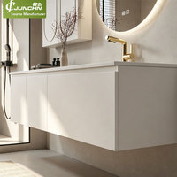 Meuble-lavabo flottant moderne et minimaliste en noyer, avec vasque intégrée en pierre frittée texture travertin, mobilier de salle de bain