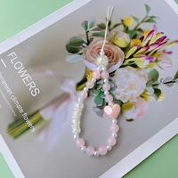 Nouvelle chaîne de téléphone perlée avec pendentif à breloque arc bracelet anti-perte lanière courte coque de téléphone imprimée numérique