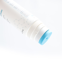 Tube en plastique cosmétique blanc souple avec brosse en silicone pour mousse nettoyante visage