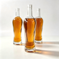 Bouteille en verre transparente ronde haute de 700 ml, personnalisée en usine, pour l'emballage de whisky, brandy, tequila, rhum et autres spiritueux