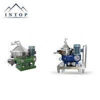 Petite centrifugeuse à disques pour la séparation du lait écrémé, avec capacité de séparation en deux phases