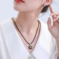 Ensemble de bijoux texturés ronds rétro XUPING, collier en cordon de cuir noir et boucles d'oreilles clous, ensemble 2 pièces pour femme, usage quotidien, vente en gros
