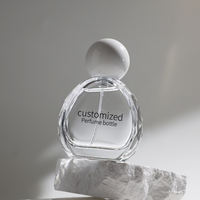 Flacon de parfum en verre transparent de luxe à motif rayé de 100 ml avec pompe pulvérisatrice et couvercle plat en verre épais