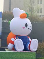 Modèle de lapin gonflable personnalisé mignon, mascotte gonflable en tissu Oxford avec carotte pour la décoration des centres commerciaux