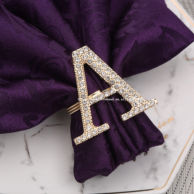 A in gold with rhinestone