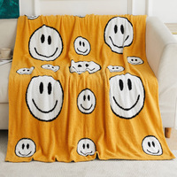 Selimut Sofa Flanel Ramah Lingkungan Rajutan Jacquard Setengah Sisi Kustom OEM 100% Poliester dengan Desain Wajah Tersenyum Bersulam