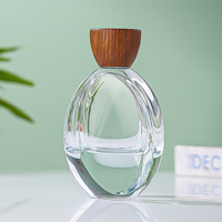 Flacon de parfum ovale transparent personnalisé de luxe 100 ml, flacon d'eau de Cologne à fond épais, bouchon en bois, vaporisateur de parfum