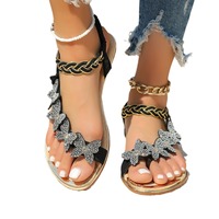 Sandales plates pour femmes avec strass papillon, anneau d'orteil et bride élastique tressée à la cheville, pour l'été, la plage et les occasions décontractées