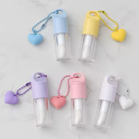 Vente en gros de tube de brillant à lèvres vide transparent avec grande brosse chaîne d'amour quantité minimale de commande bas emballage cosmétique de rouge à lèvres liquide en plastique bouchon à vis
