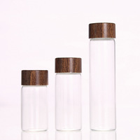 Flacon en verre cylindrique transparent en borosilicate de 24 mm 30 mm avec bouchon à vis en bois pour l'emballage alimentaire et le stockage de tri des grains de café