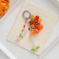 Porte-clés esthétique mignon en forme de fruit, fait main, perlé, avec pompon floral, kaki, cerise, muguet, pendentif pour sac ou téléphone