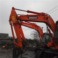 Excavatrice sur pneus Doosan Dh130 d'occasion Excavatrices sur pneus Doosan 130 140 d'occasion à vendre
