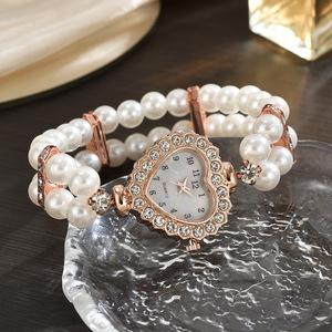 Stylish <b>watch</b> featuring a heart-shaped dial fully set with rhinestones and pearls, a petite strap, and a beautiful double-row pe - Product Image 2