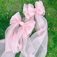Grand nœud en organza rose de luxe pour la décoration visuelle des vitrines et des événements