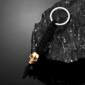 Llavero Creativo de Calavera en Oro y Plata, Esqueleto de Acero Inoxidable con Cuerda Trenzada a Mano, Amuleto Unisex, Regalo - Product Image 1