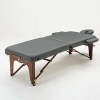 Table de massage portable et pliable en bois moderne pour salon et hôtel