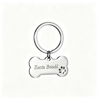 Porte-clés tendance en acier inoxydable, forme d'os avec empreinte de patte mignonne, gravure personnalisée, anti-perte, finition brillante, avec anneau fendu