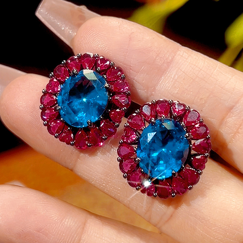 Clous d'oreilles en cristal pointu bleu or noir