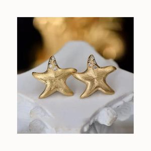 Pendientes Xinfly Hipoalergénicos Antideslustre de Oro Puro Genuino de 18kt AU750 con Diseño de Estrella de Mar y Diamantes, Acabado Mate Cepillado, Estilo Funky - Product Image 1