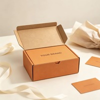 Boîte d'expédition en carton ondulé mat orange personnalisée, imprimée avec le logo de la marque privée, pour l'emballage de vêtements et de produits quotidiens