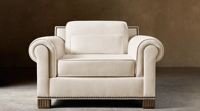 Fauteuil de salon de luxe moderne à silhouette généreuse, avec coussins moelleux et coutures soignées