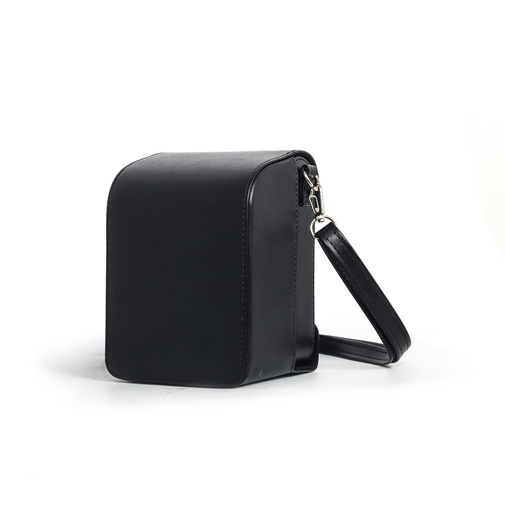 sac pour appareil photo en cuir noir avec bandoulière noire