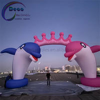 Arche gonflable personnalisée en forme de dauphin avec couronne rose pour les fêtes d'anniversaire des enfants et la décoration d'événements aquatiques