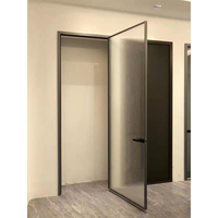 Porte battante en verre au design moderne avec matériau en alliage d'aluminium coupe-vent pour décoration intérieure d'hôtel