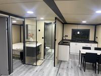 Maison préfabriquée modulaire en acier de 20 pieds, maison miniature pliable en plein air, salon extensible, utilisation hôtelière peu coûteuse et mobile