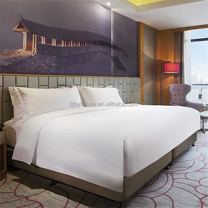 Vente directe d'usine, ensemble de meubles de chambre d'hôtel 3 étoiles sur mesure et économique, avec tête de lit capitonnée et tables de chevet. - Product Image 1