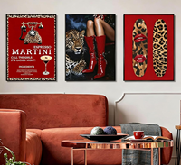 Art mural Trio de bottes rouges et léopard encadré noir mat épuré pour les commandes de décoration de bars et salons sur le thème Commonwealth