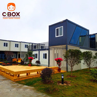 Cbox Maison conteneur modulaire préfabriquée à deux étages avec mur-rideau en verre, bureau, balcon et escalier