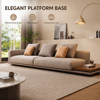 Canapé bas taupe avec table d'appoint intégrée en bois, rembourrage doux, confort élégant, design chaleureux, style maison douillette, salon