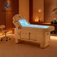 Lit de massage électrique moderne de luxe avec lumière LED en cuir véritable pour hôtel, école, entrepôt et chambre à coucher