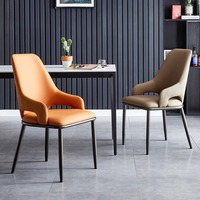 Ensemble de salle à manger ergonomique rembourré, dossier incurvé minimaliste, coussin de siège en mousse souple, pieds en métal noir pour une utilisation moderne dans un café