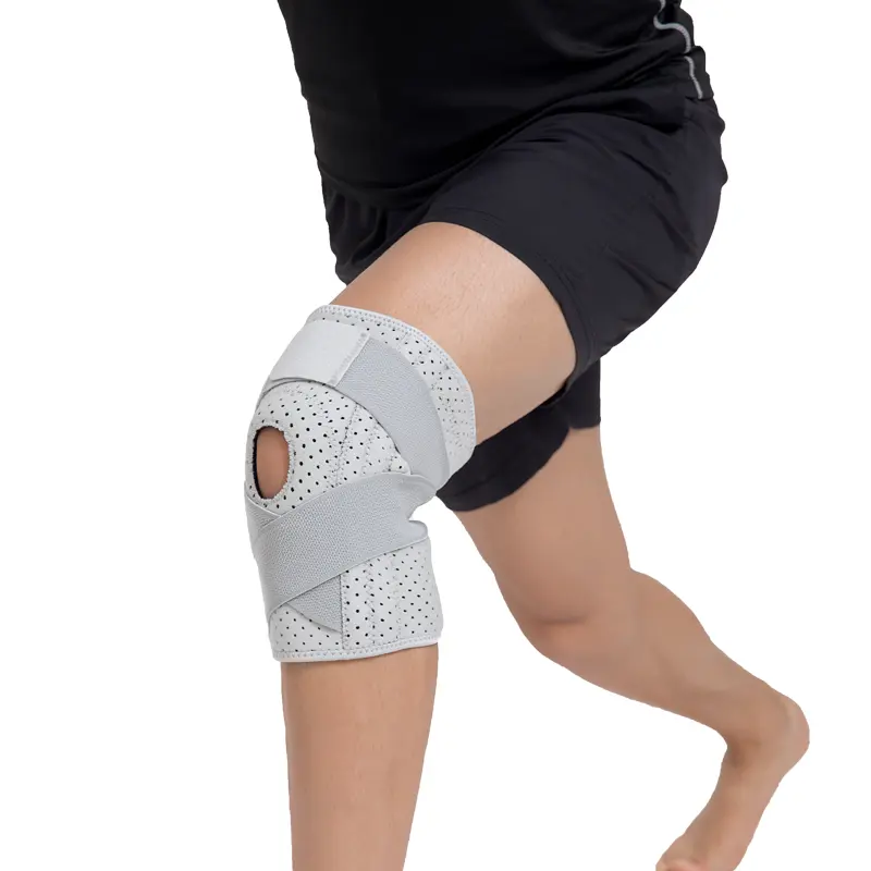 La protezione del supporto sportivo a compressione avvolge le ginocchiere personalizzate con molle e stabilizzatore laterale