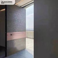 Porte d'entrée pivotante contemporaine en alliage d'aluminium texturé minéral mat, avec support pivotant dissimulé pleine hauteur et isolation phonique et hydroacoustique.